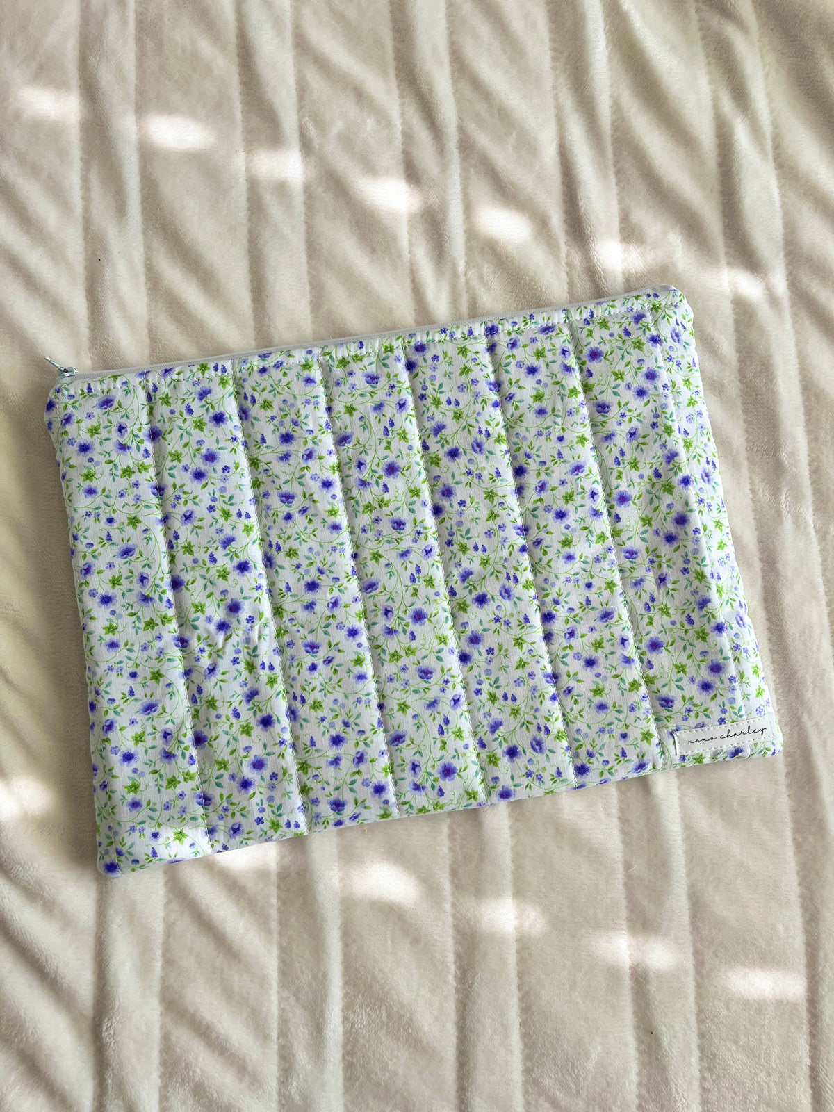 Purple floral laptop & tablet sleeve with ruffled elastic top and zipper