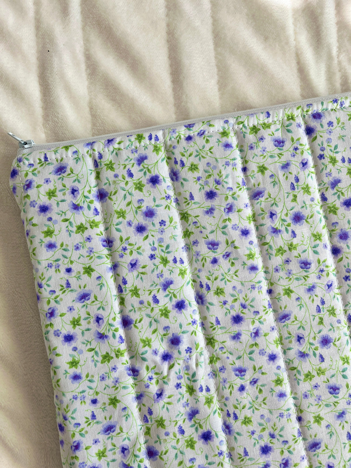 Floral laptop & tablet sleeve, white fabric with blue and green small flowers
