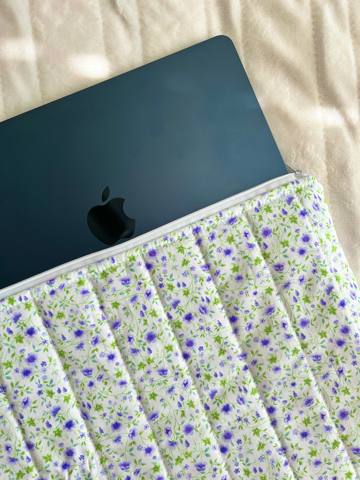 Floral laptop & tablet sleeve with zipper, dark tablet partially inside