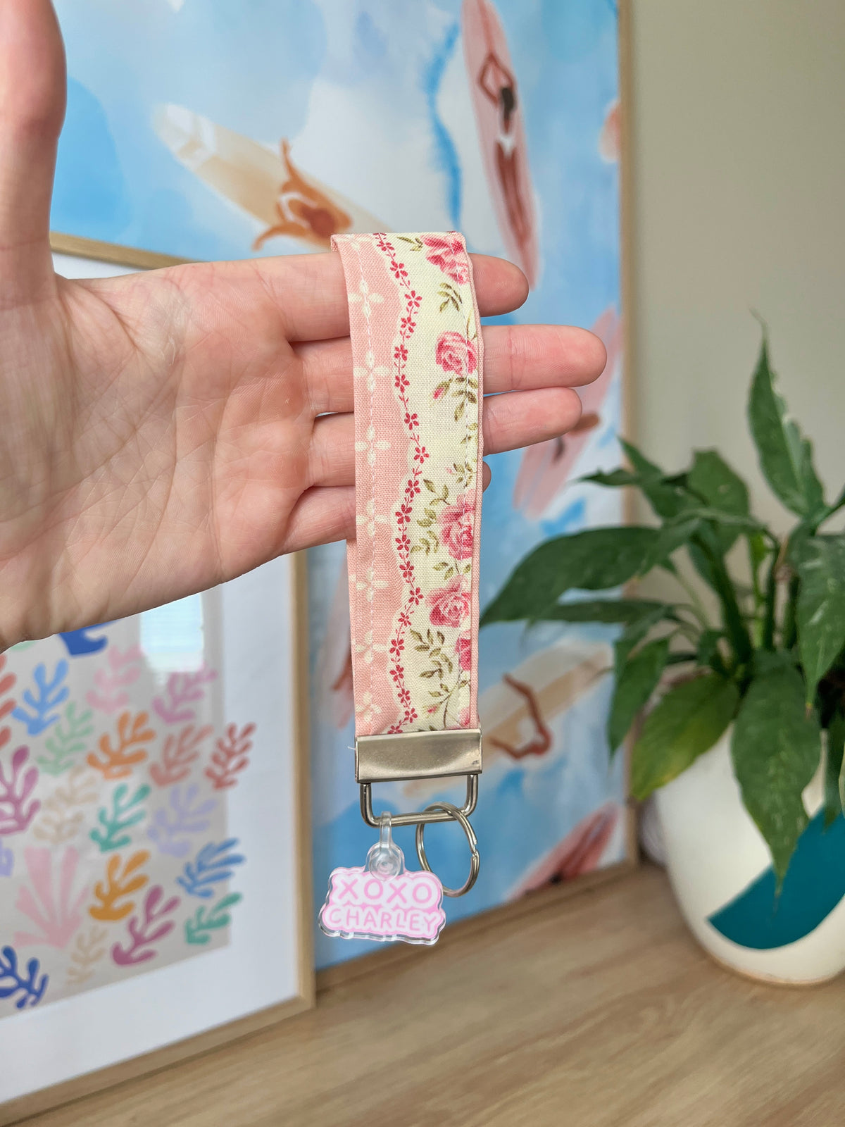 Floral keychain wristlet strap with pink fabric, metal clip and XOXO charm