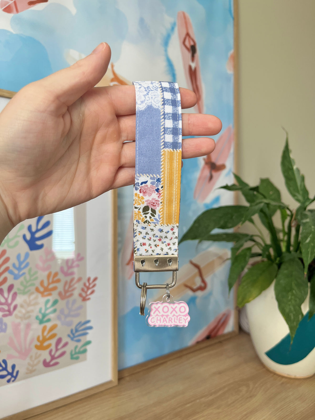 Patchwork fabric keychain wristlet with silver clip and XOXO CHARLEY charm
