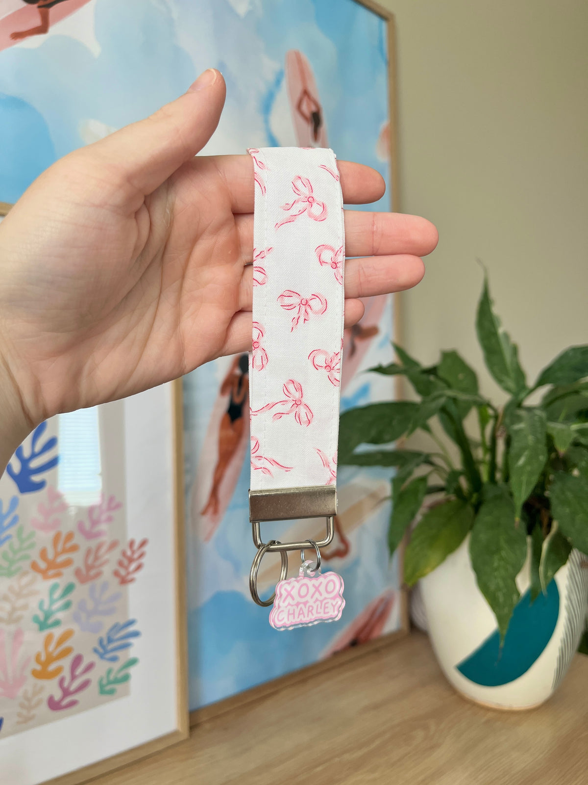Pink mini bow wristlet keychain with lobster clasp and fabric pattern
