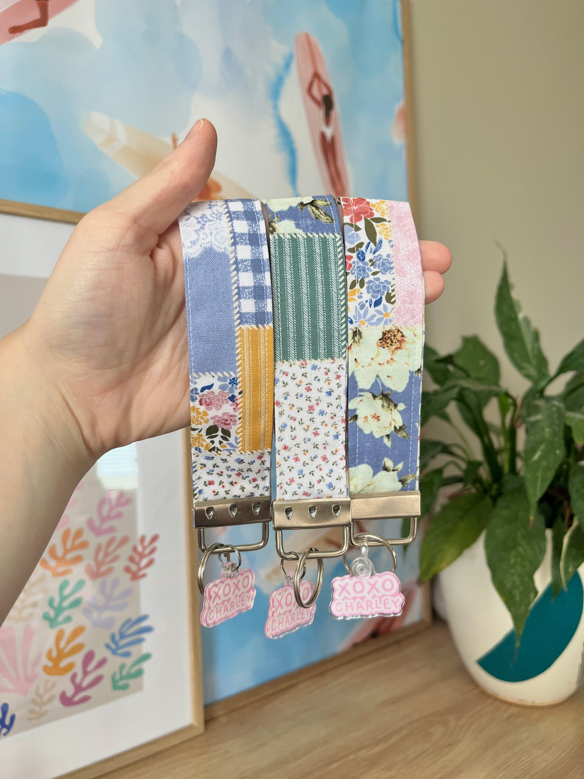 Colorful patchwork wristlet strap with silver clips and XOXO CHARLEY charms