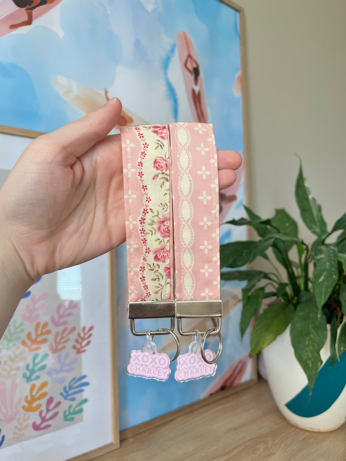 Floral wristlet keychain with pink fabric and metal lobster clips, XOXO charm