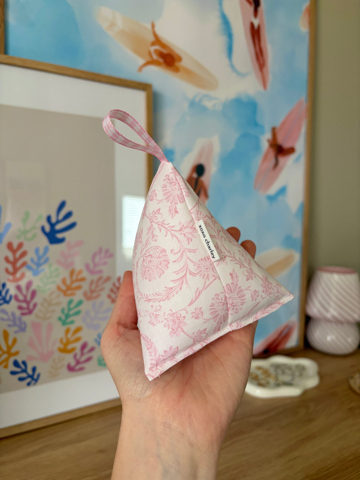 Pink floral patterned fabric weight bag with ribbon tie and label