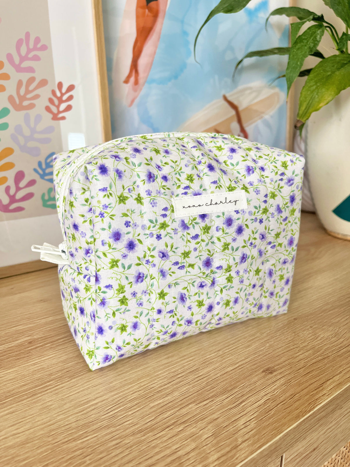 Medium floral makeup bag, purple and white print, white zipper