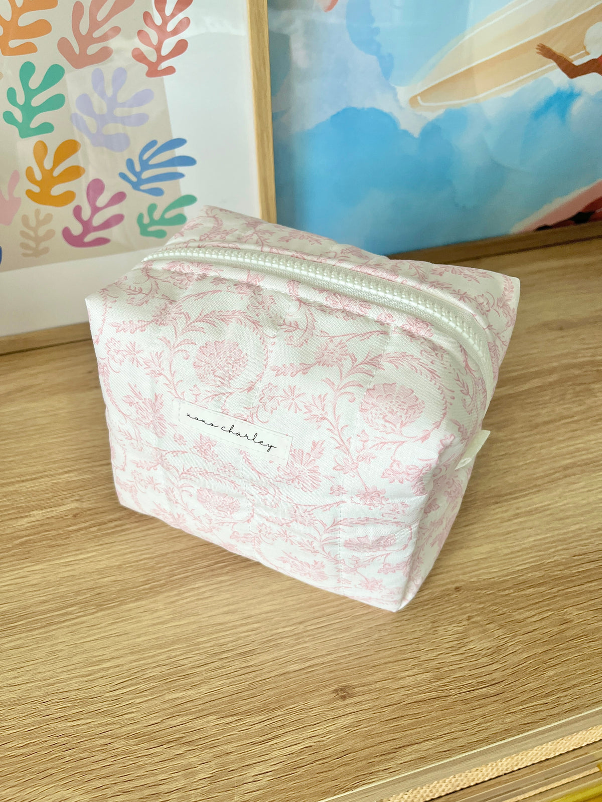 Pink floral medium makeup bag with top zipper and rectangular shape