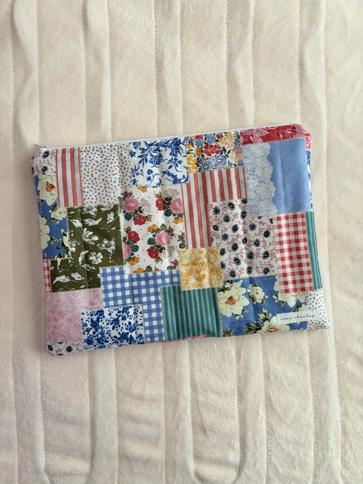 Patchwork laptop and tablet sleeve with multicolor floral and stripe panels