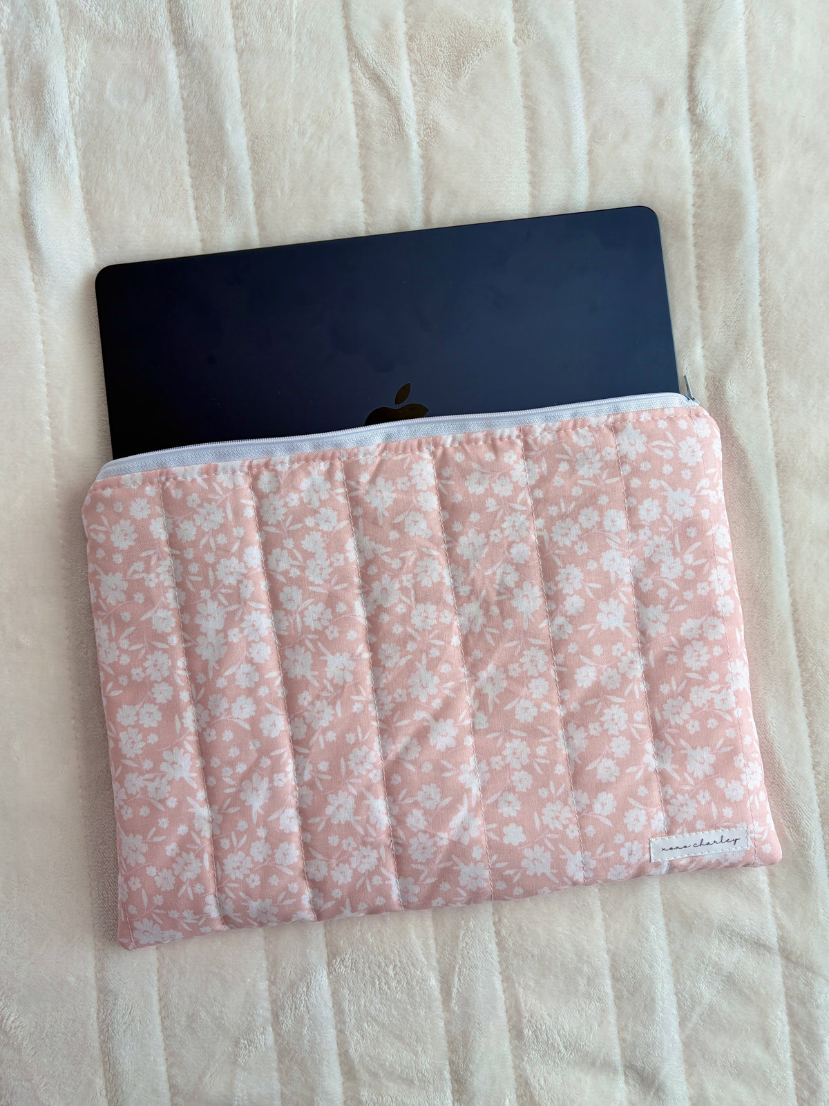 Floral laptop and tablet sleeve in blush pink with white flowers and light blue zipper