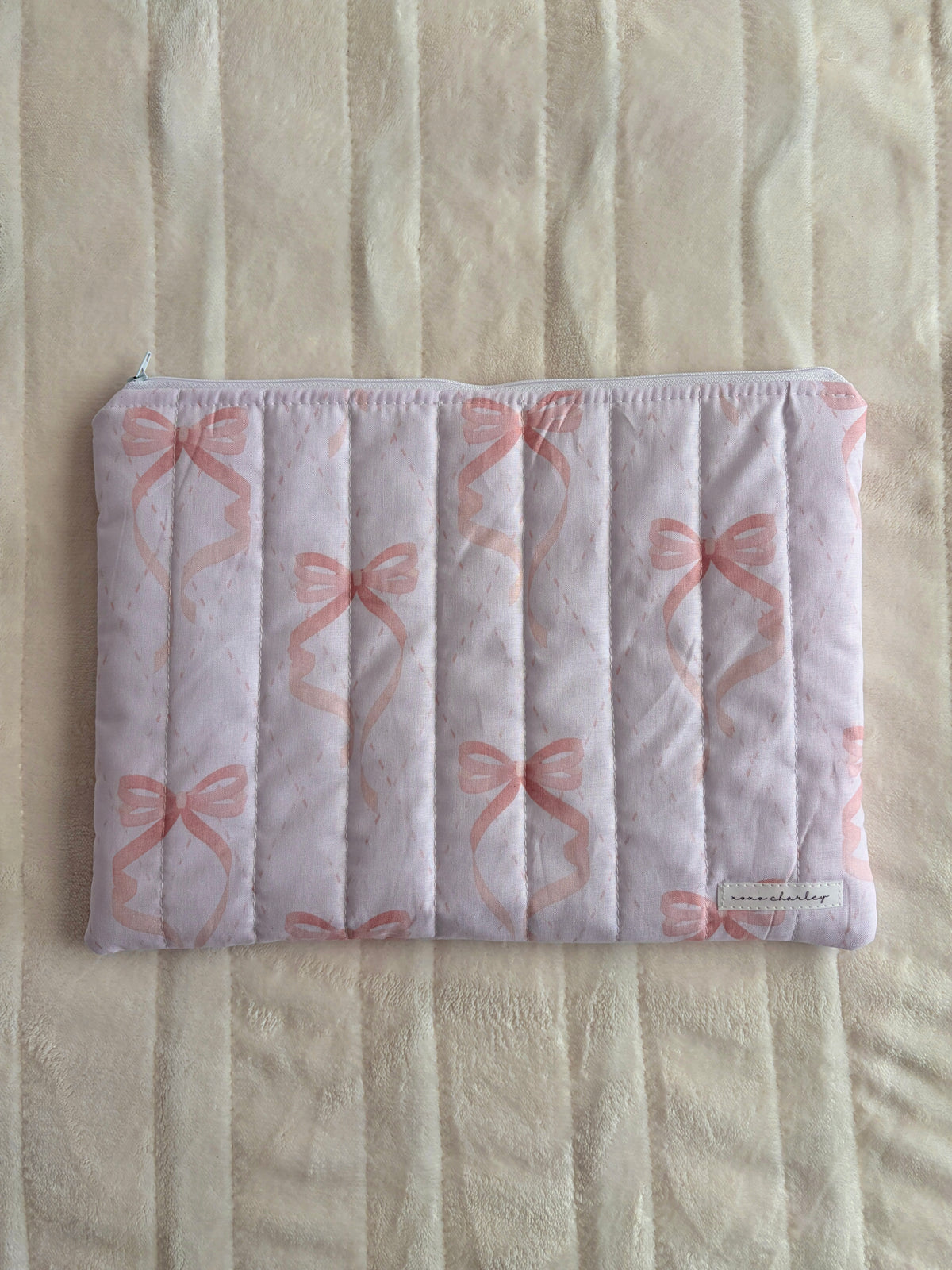 Pink bow quilted laptop and tablet sleeve with padded front pocket
