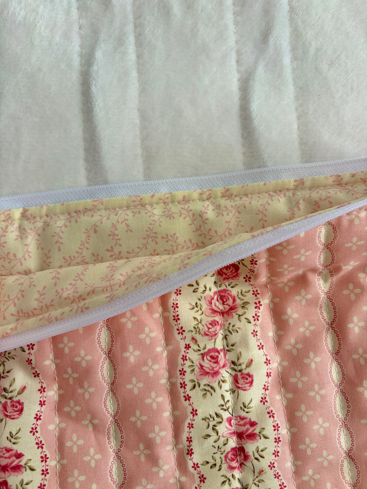 Pink floral laptop sleeve interior lining and wide zip opening