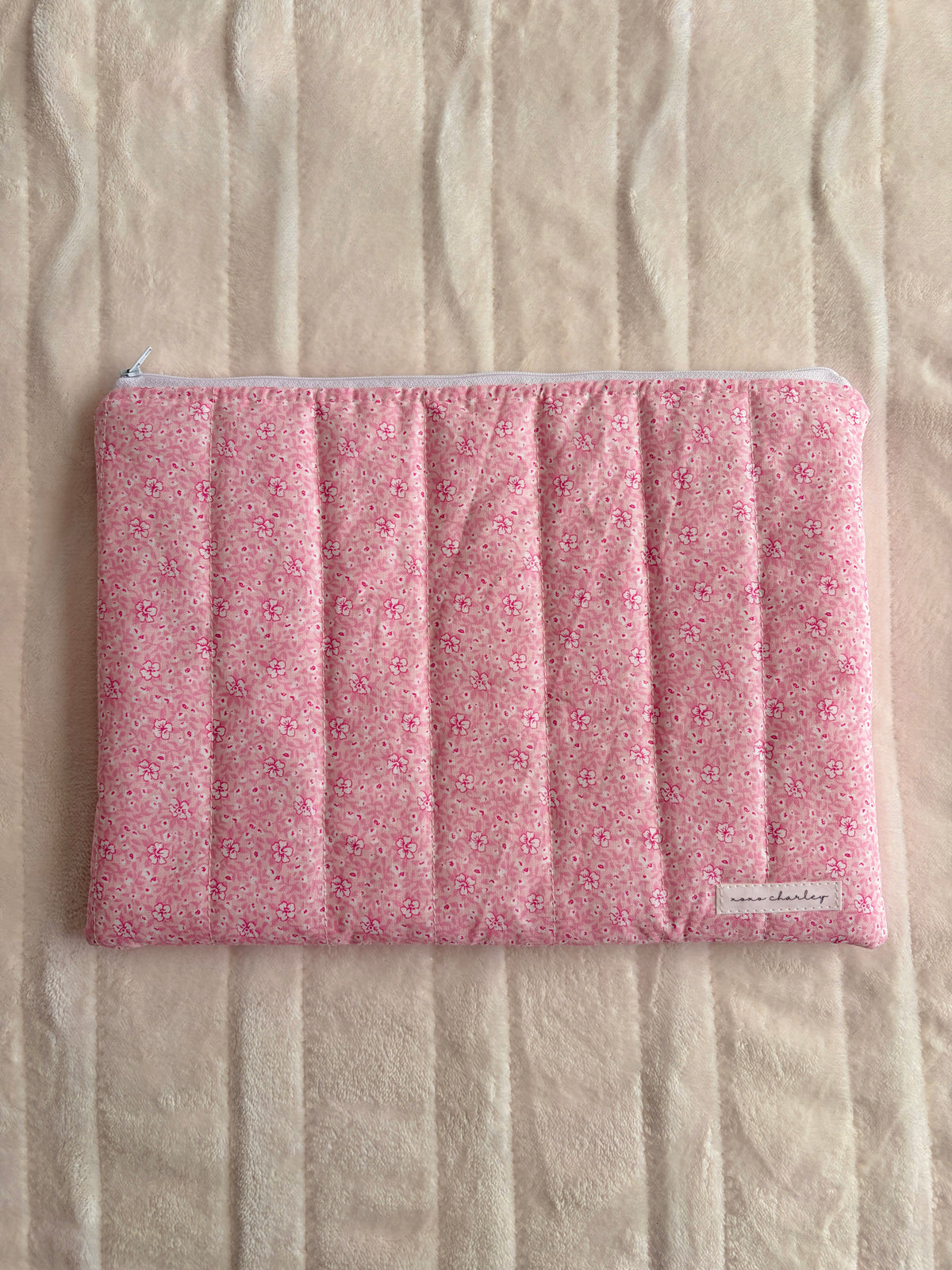 Pink floral fabric laptop and tablet sleeve with elastic top edge
