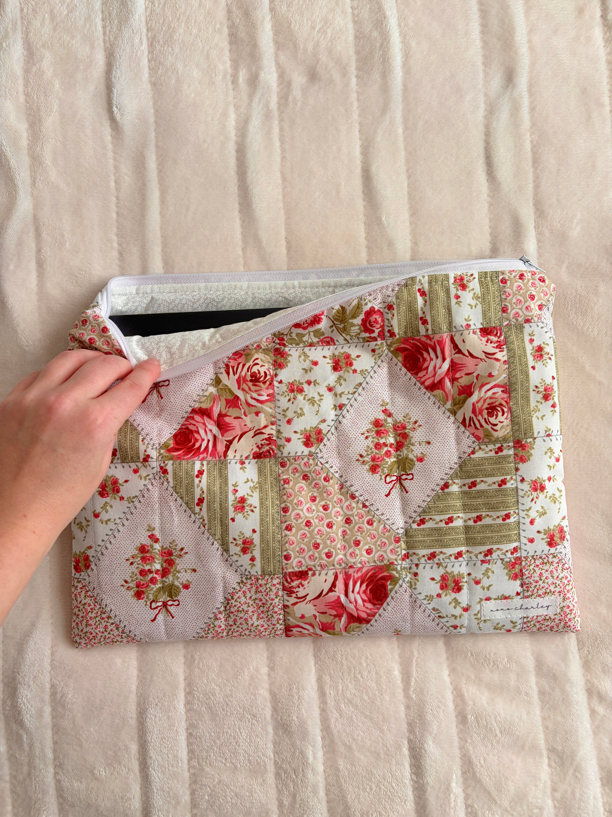 Floral patchwork laptop and tablet sleeve with open top and light gray lining