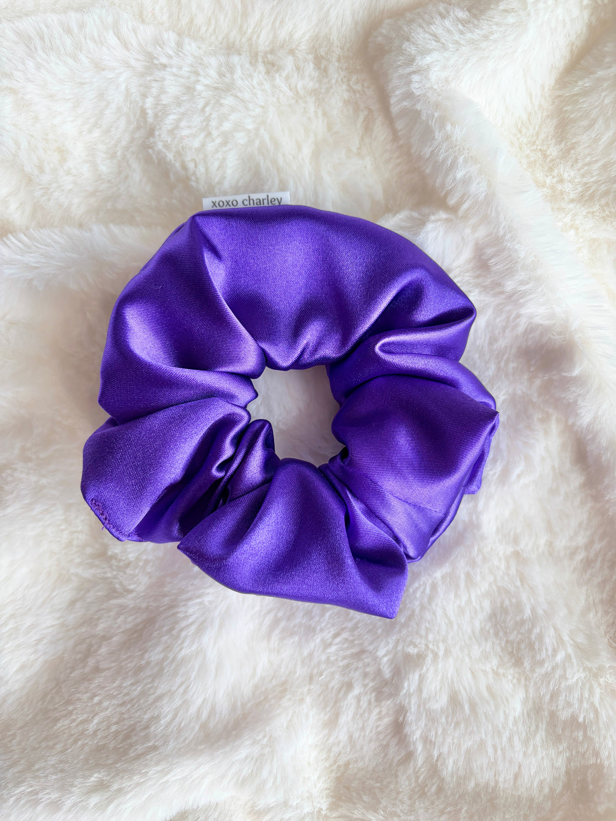 Large purple satin scrunchie with gathered, ruffled folds