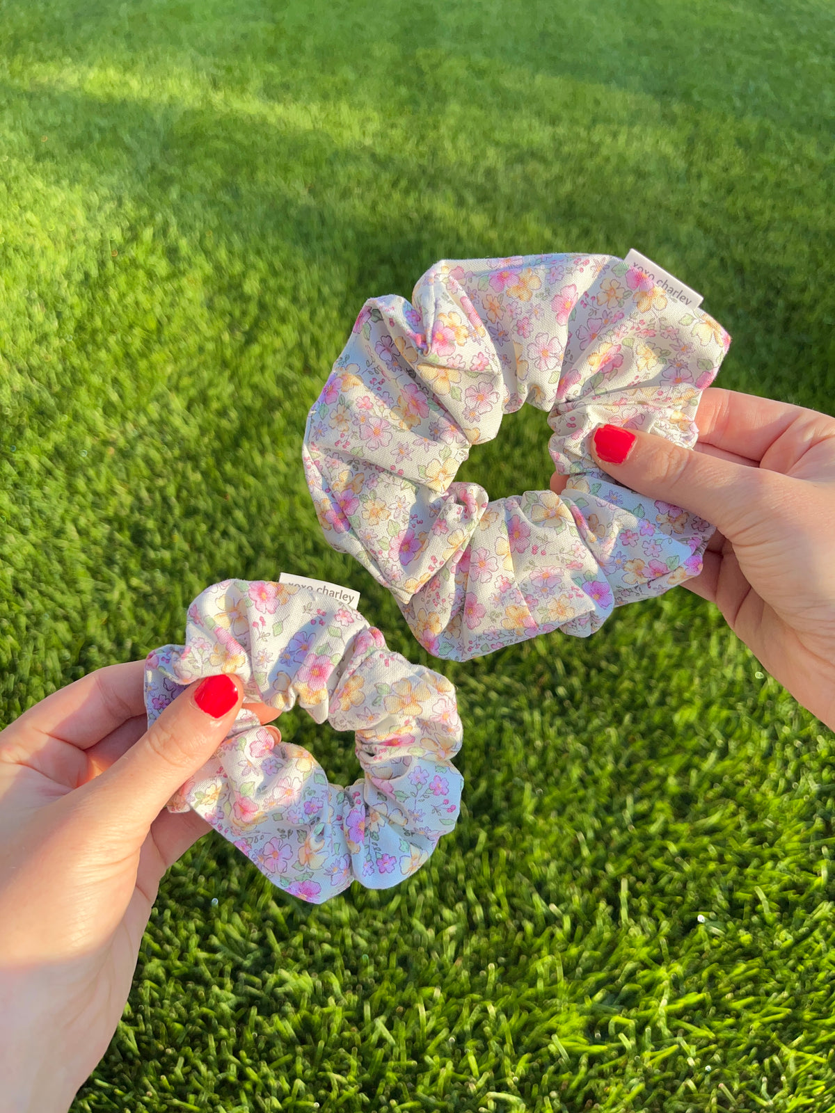 Cotton scrunchie with pastel floral print, gathered scrunched elastic.