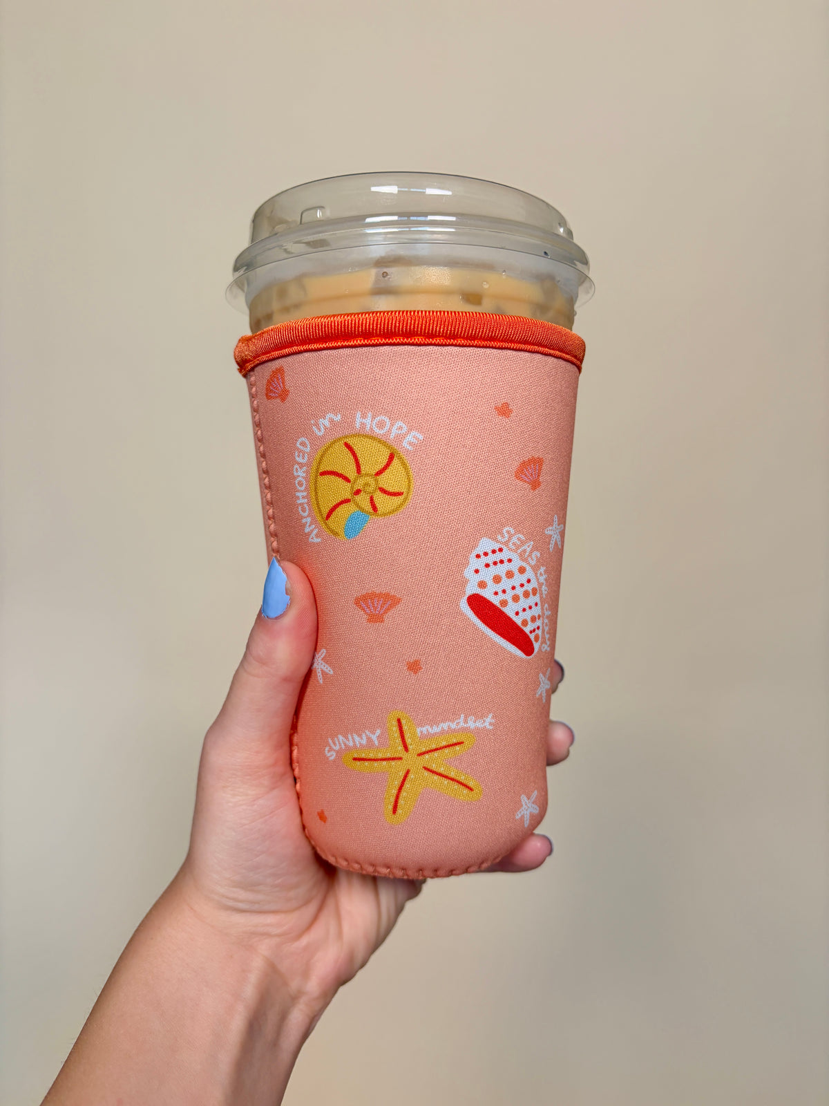 Medium cup sleeve, pink fabric with orange rim and mixed beach icon print