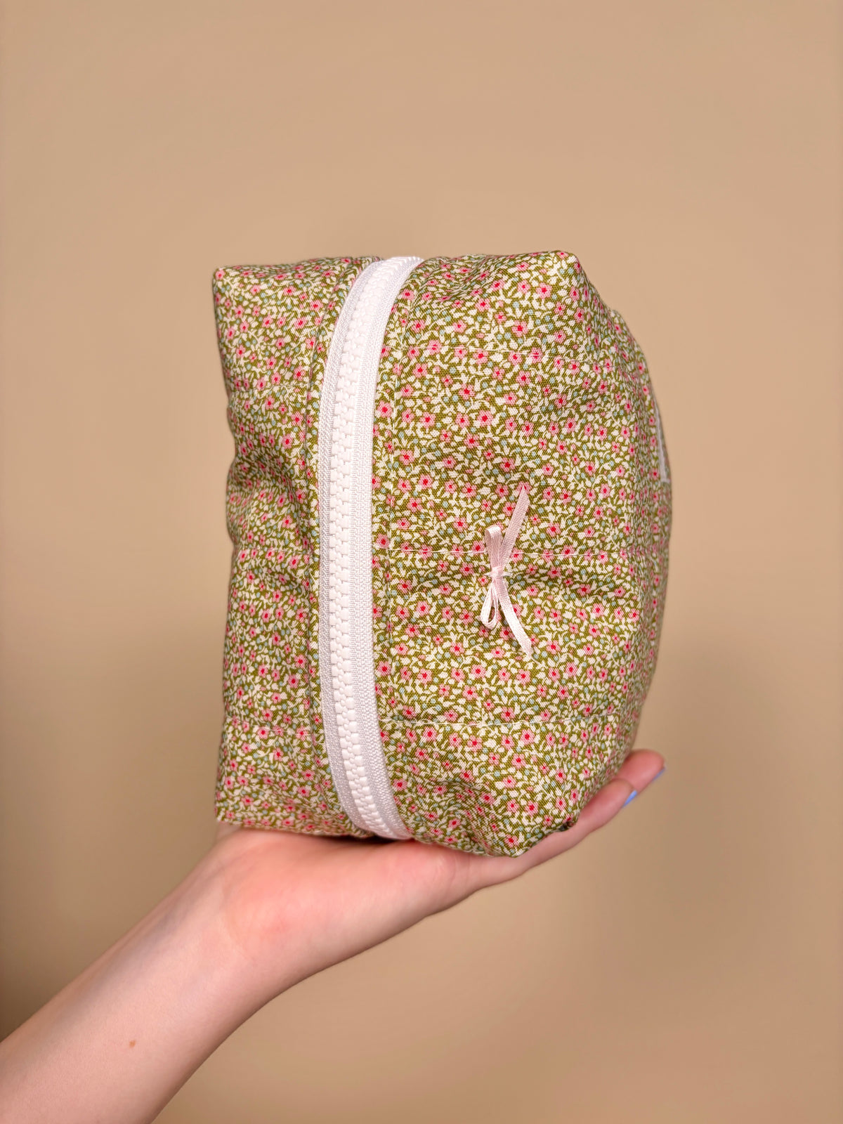 Clover Bow medium makeup bag, multicolor speckled fabric with ribbon trim