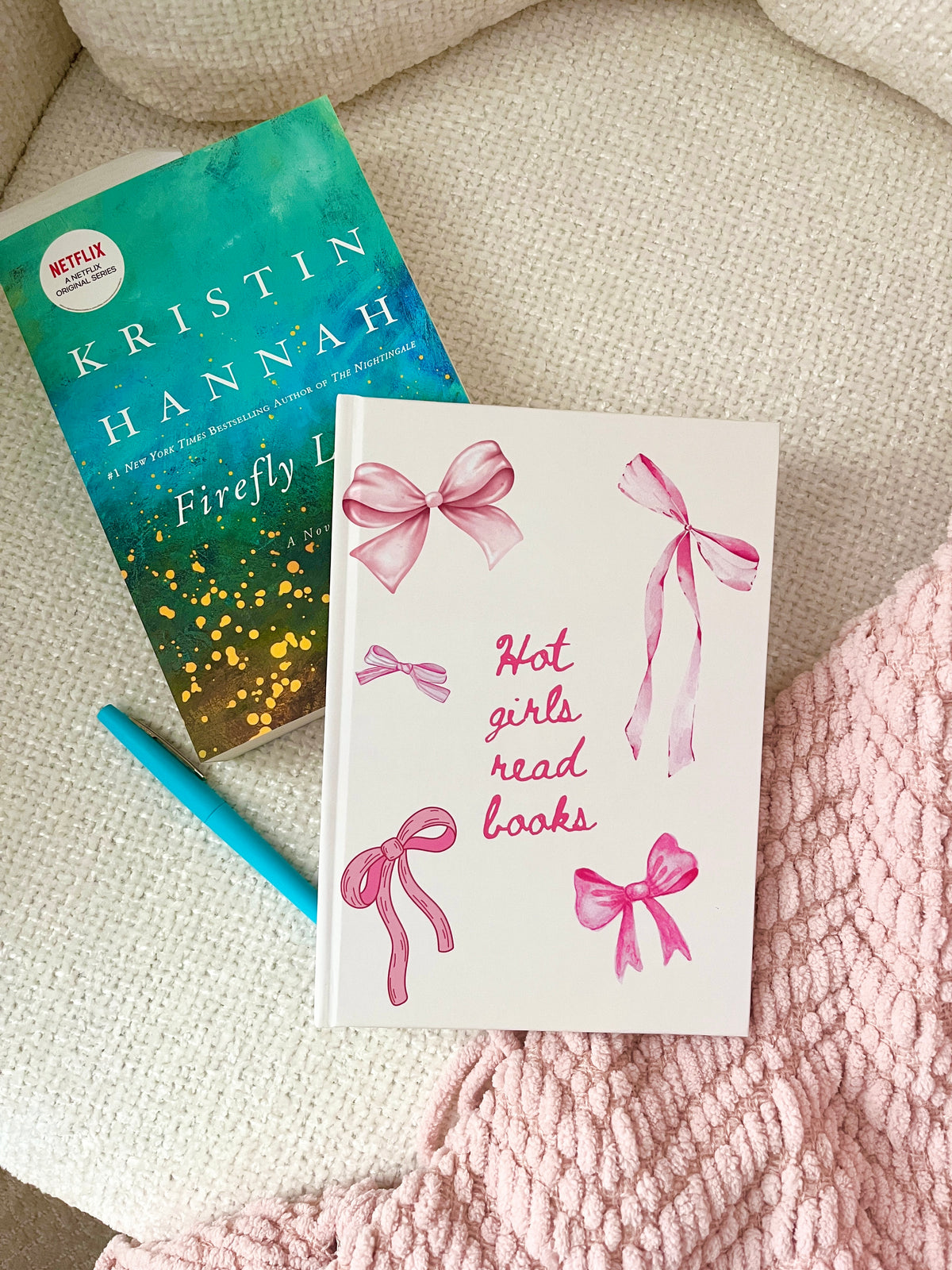 Reading journals with green and pink ribbon covers, one reading “Hot girls read books”.