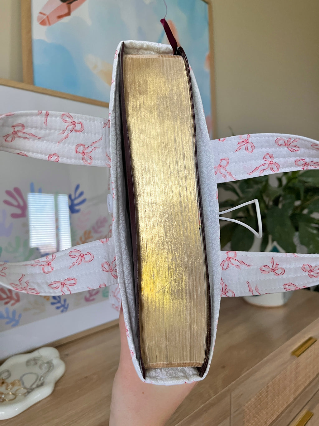 Mini bible tote holding a book, pink bow print with vertical side panel