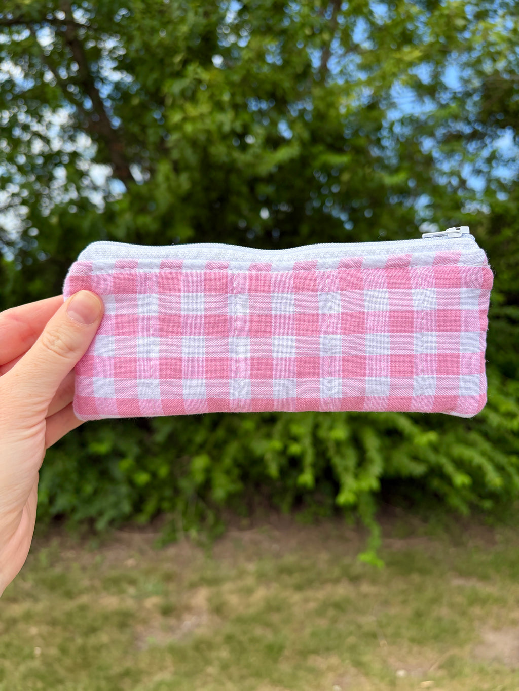 Pink gingham zippered glasses case, side view