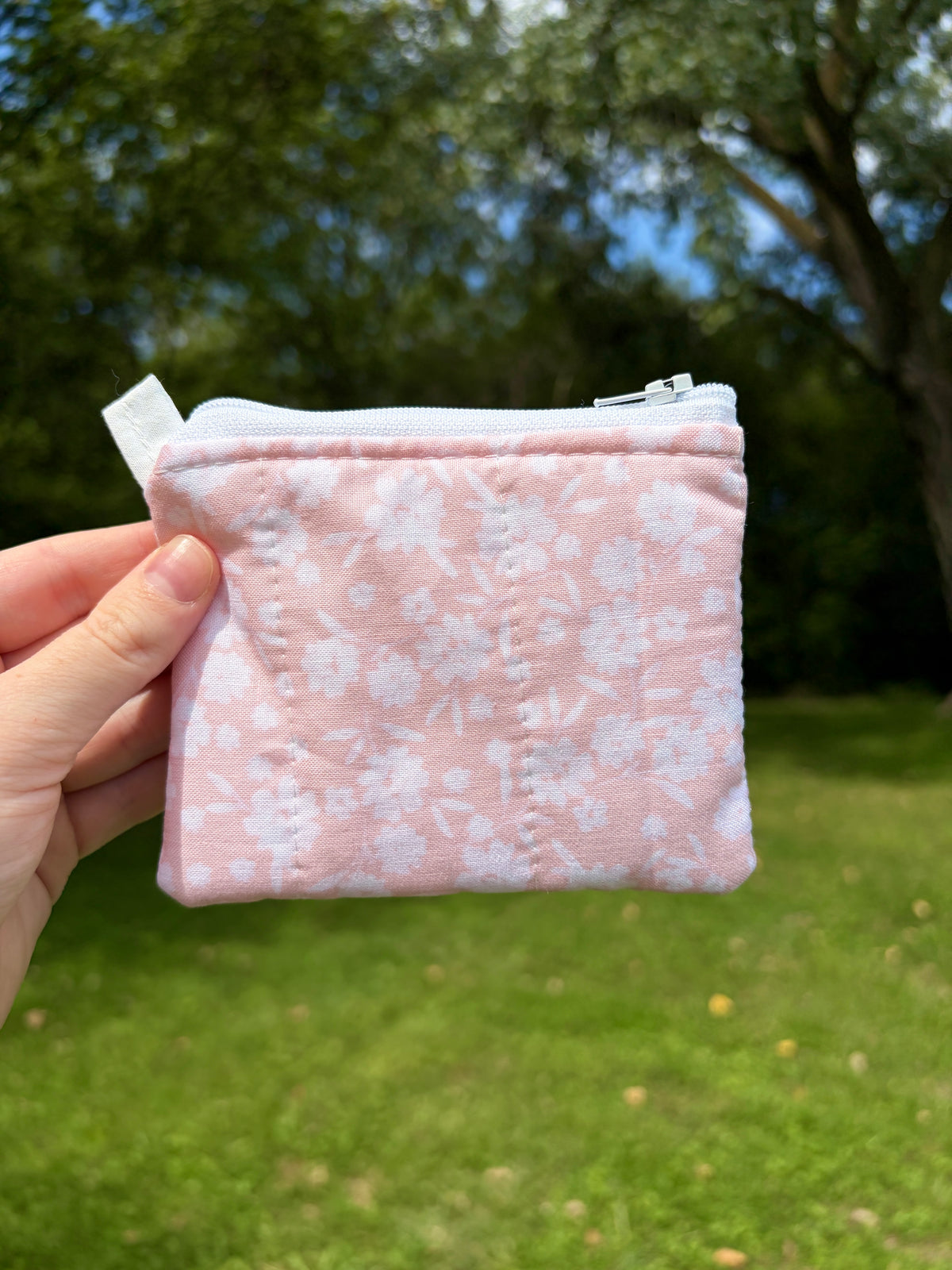 Pink floral zippered keychain wallet pouch with metal zipper and top keychain loop