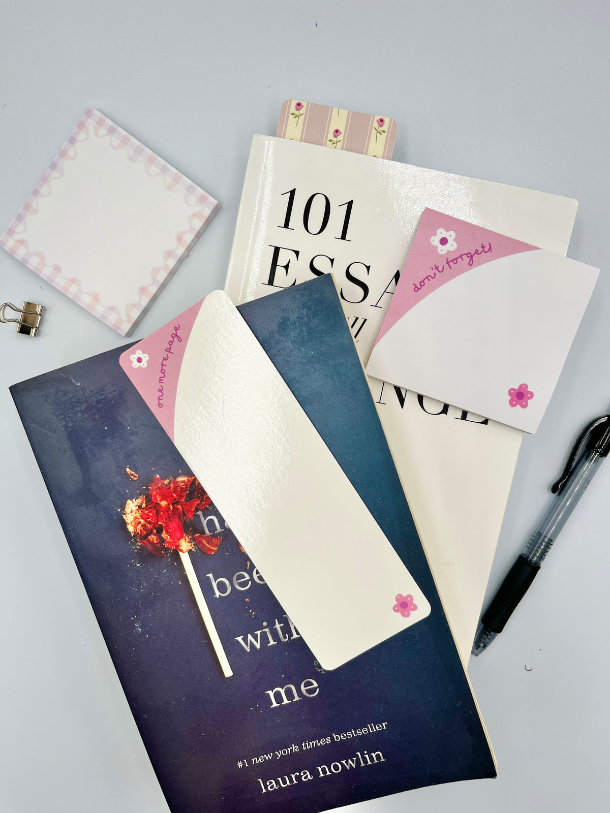 Pink and blue book bookmark with red heart graphic and floral accents