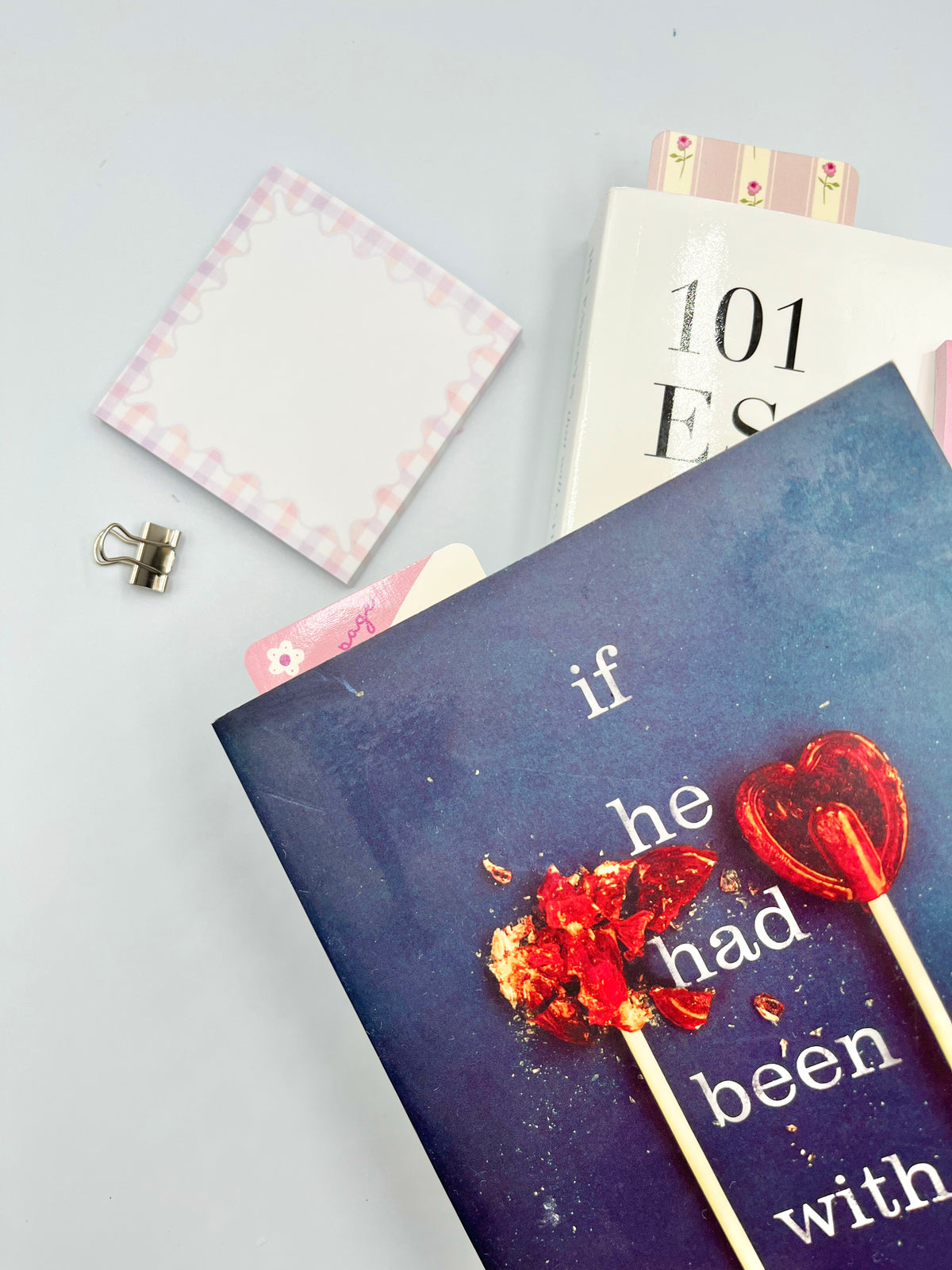Blue bookmark featuring a red heart graphic with pink floral accents
