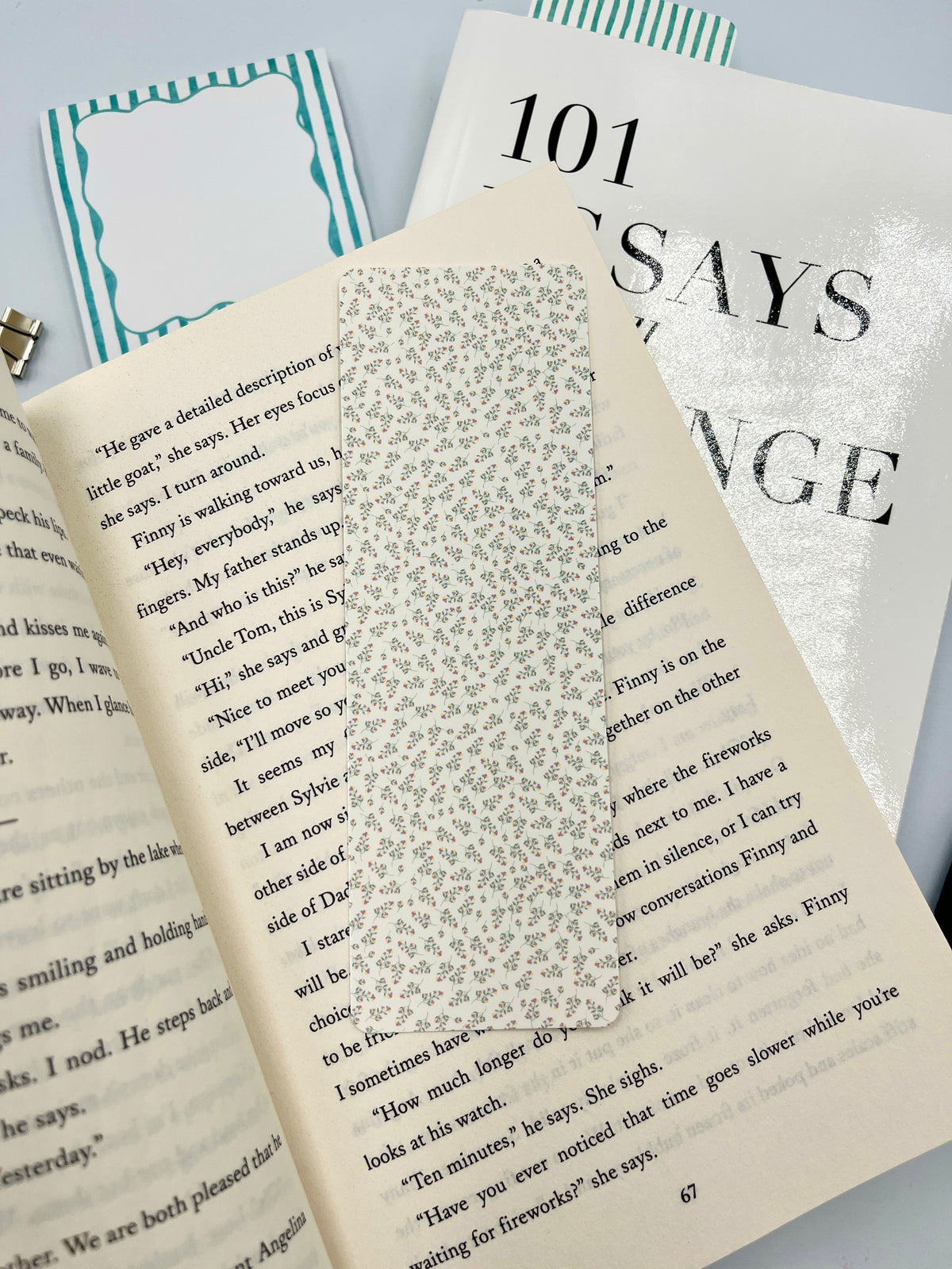 Mini floral bookmark with cream background and tiny multicolor flower pattern