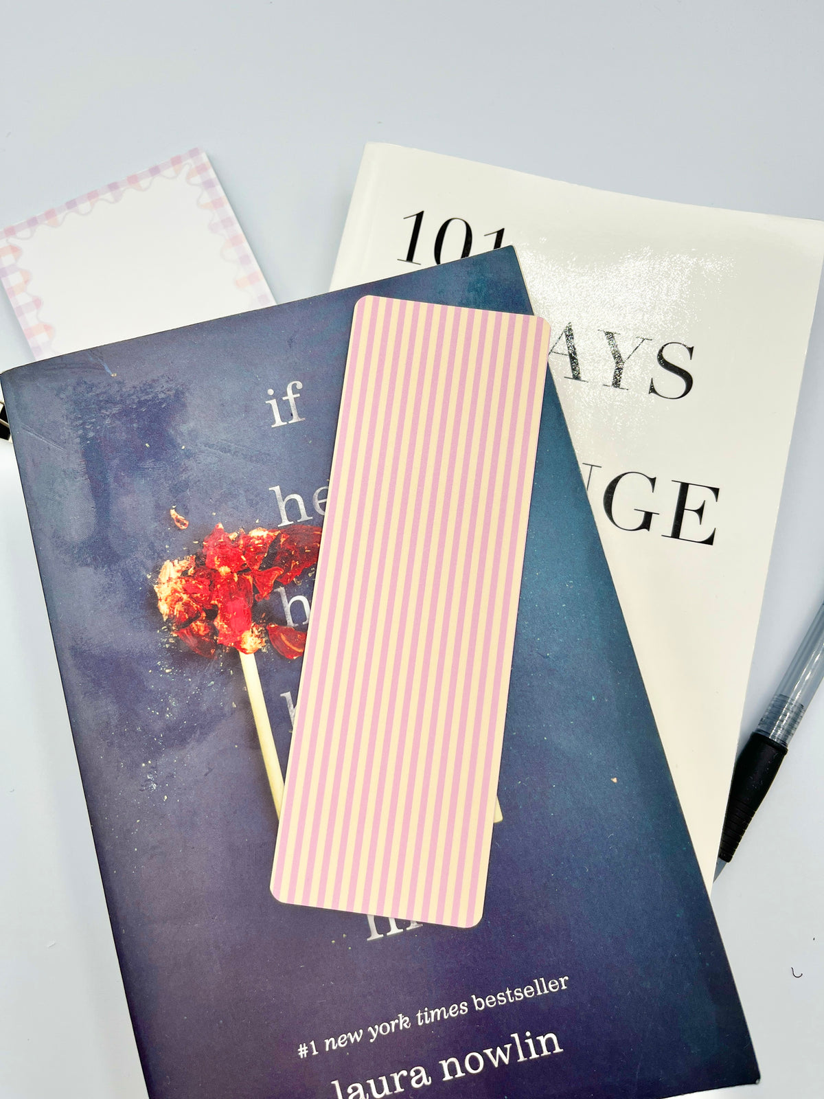 Pink and yellow vertical striped paper bookmark