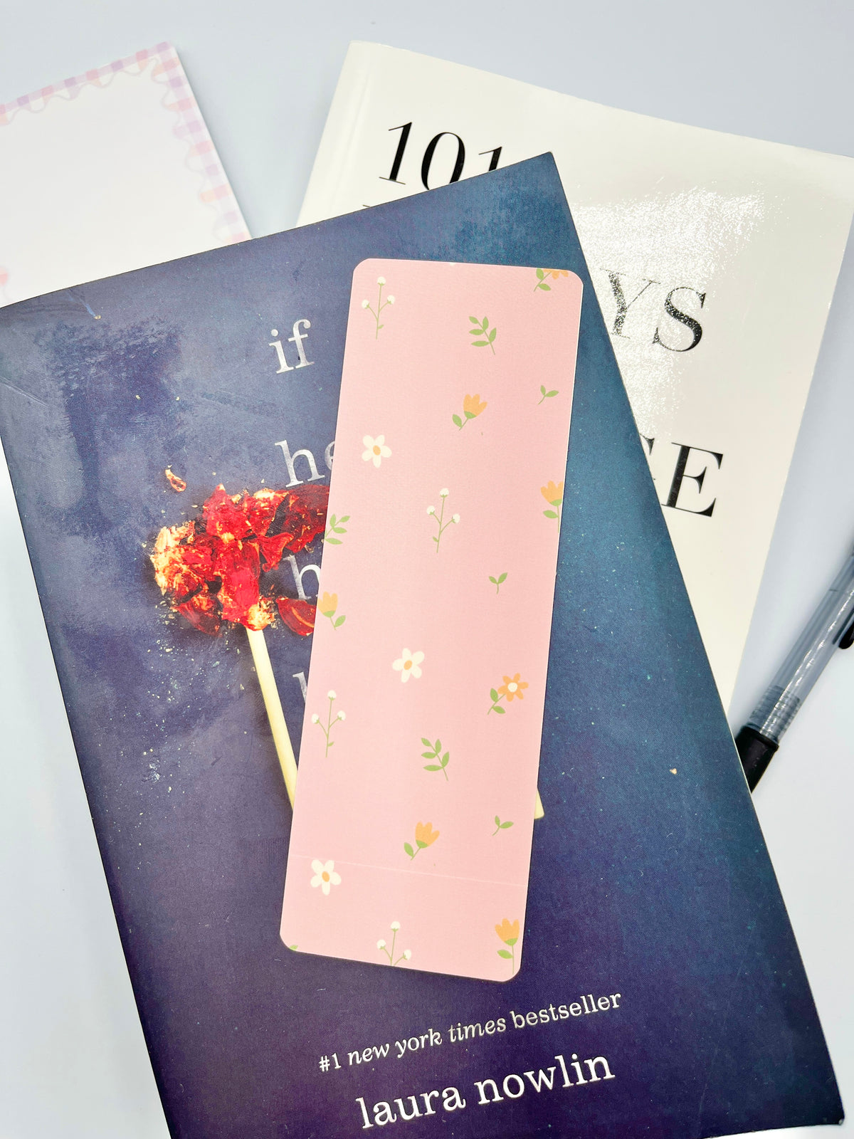 Peach floral bookmark, vertical pink rectangle with small green and yellow blossoms.