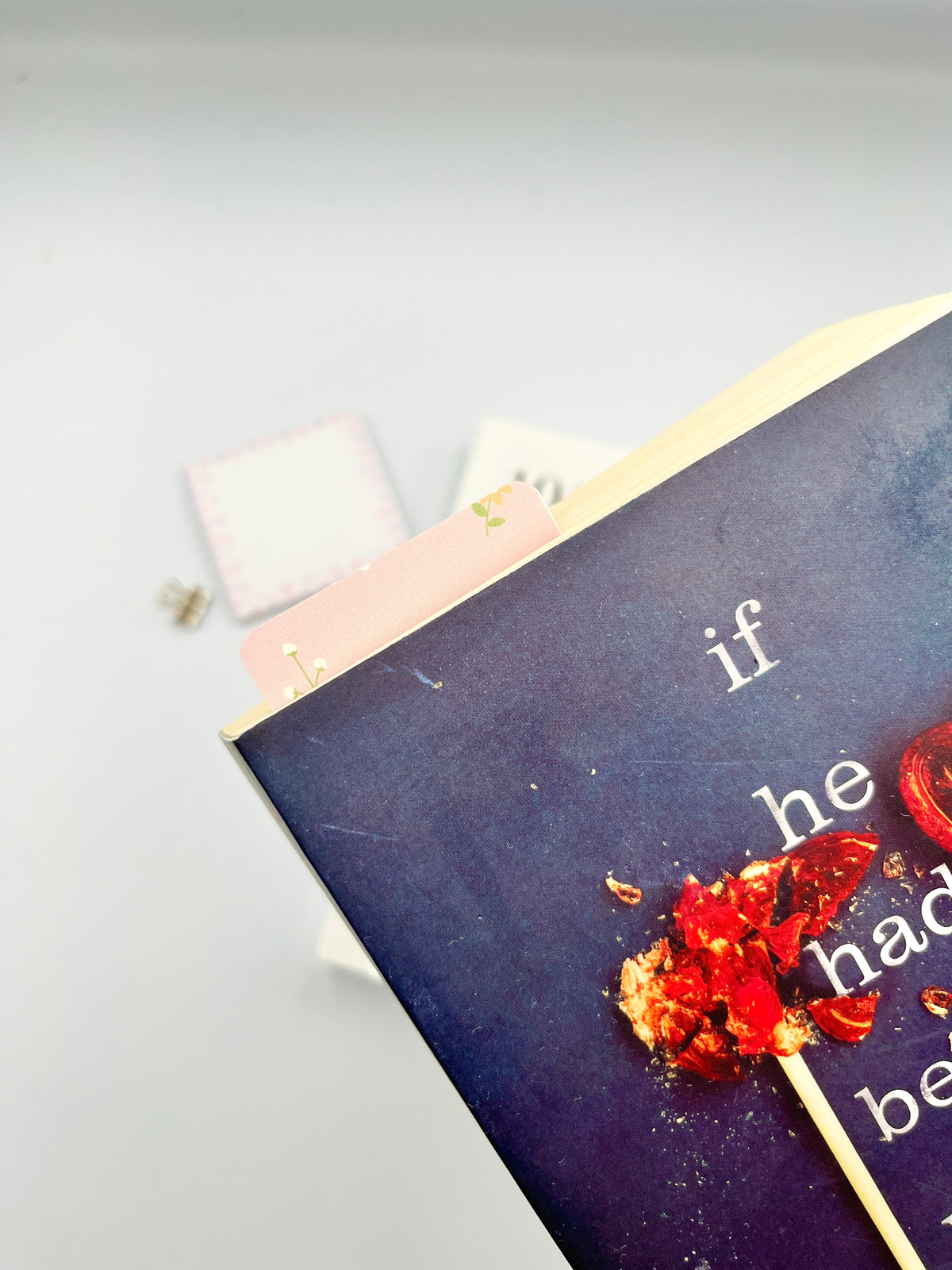 Peach floral bookmark corner detail, pink with tiny green and yellow flower icons.