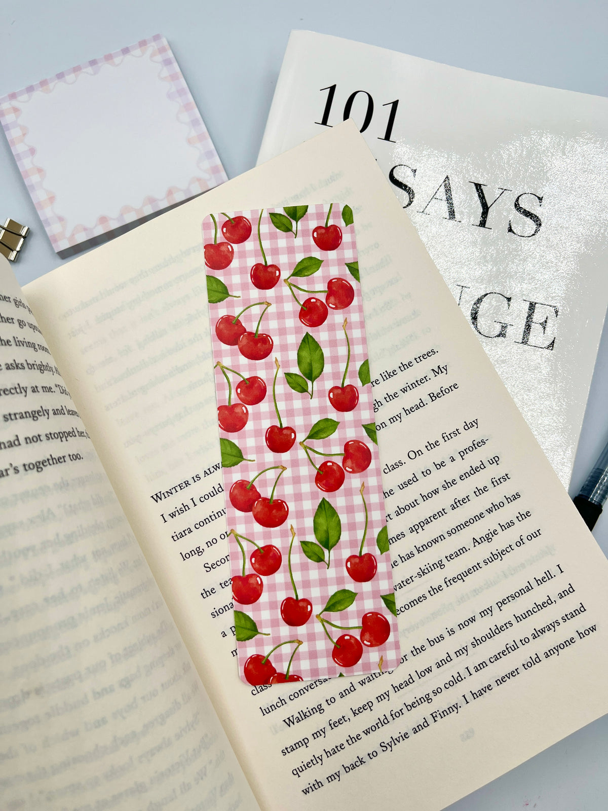 Cherry bookmark with red cherries on pink gingham, vertical layout with green leaf accents