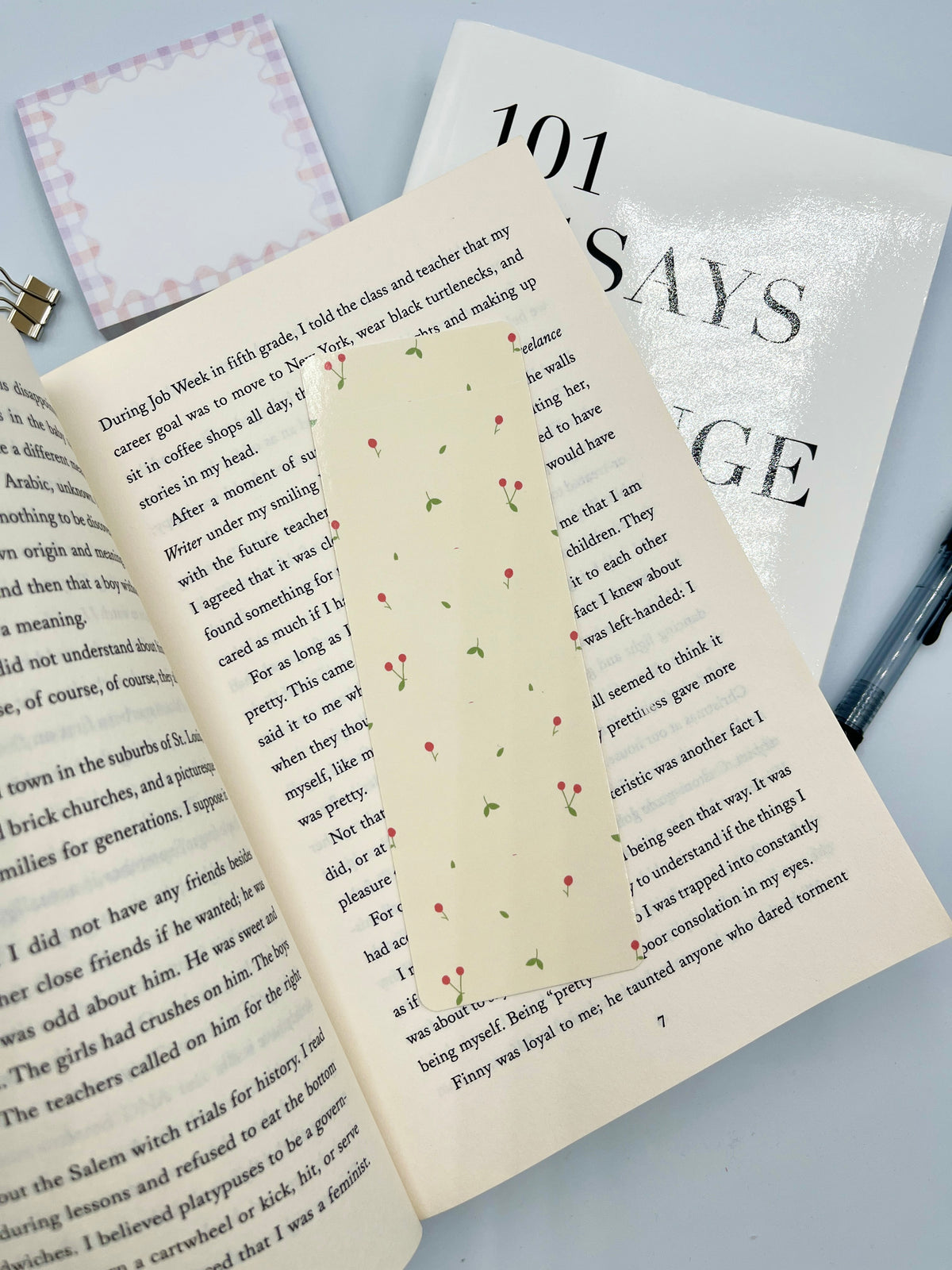 Mini cherry bookmark with white background and scattered multicolor cherry illustrations