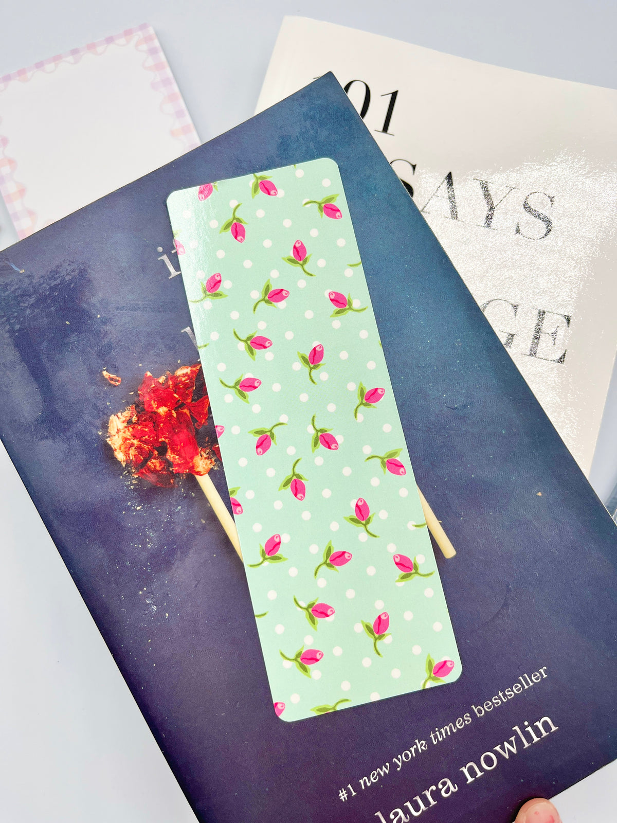 Teal rose-pattern bookmark, rectangular with pink flowers on light green-teal background