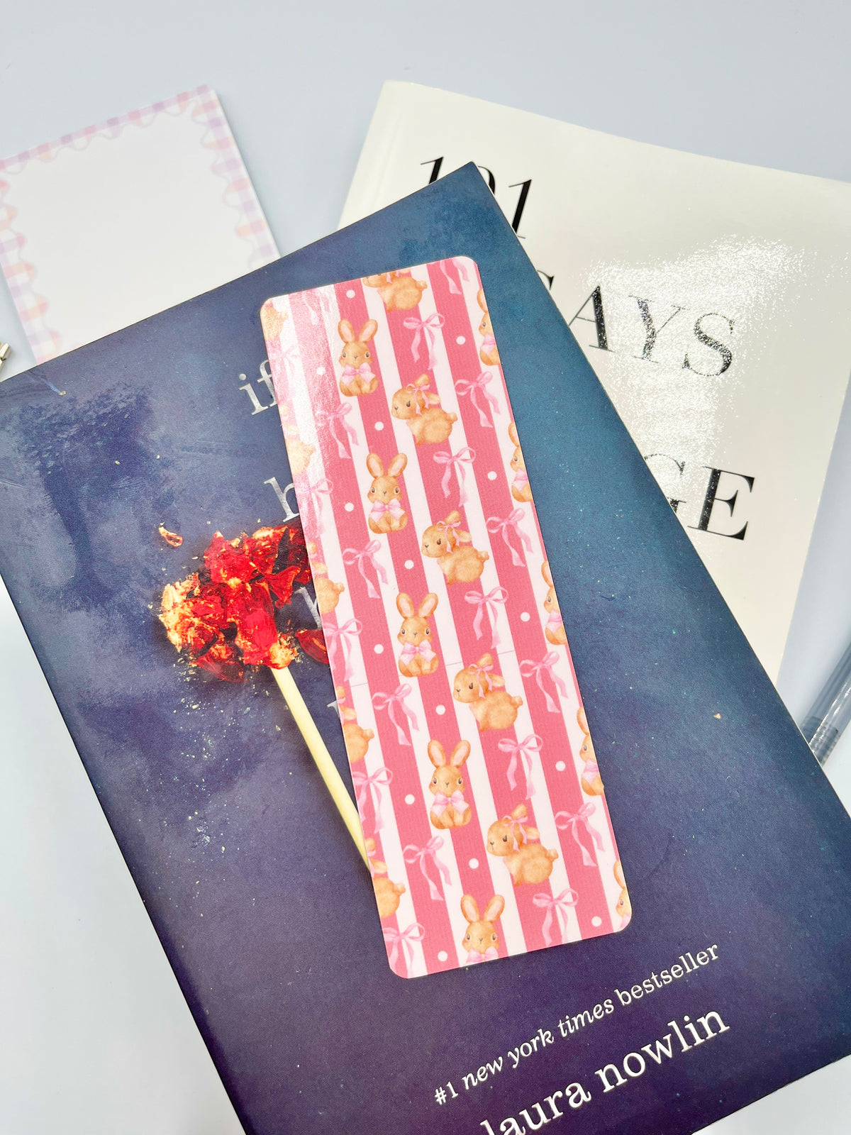 Pink bunny print bookmark with vertical stripes and decorative bunny motifs