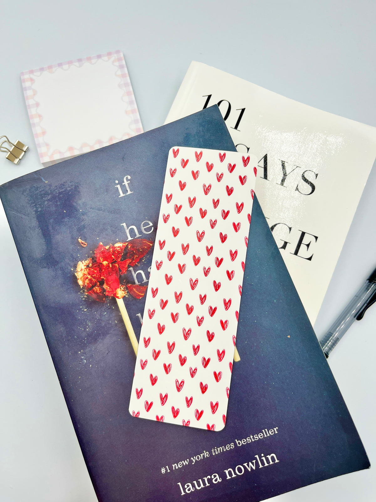 Fabric bookmark with red heart pattern on white, narrow with pointed top
