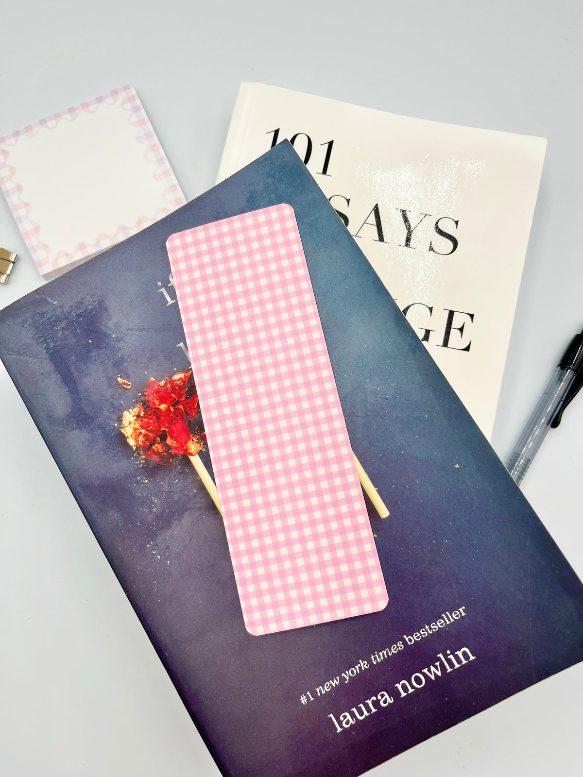 Pink gingham fabric bookmark strip with straight bottom edge