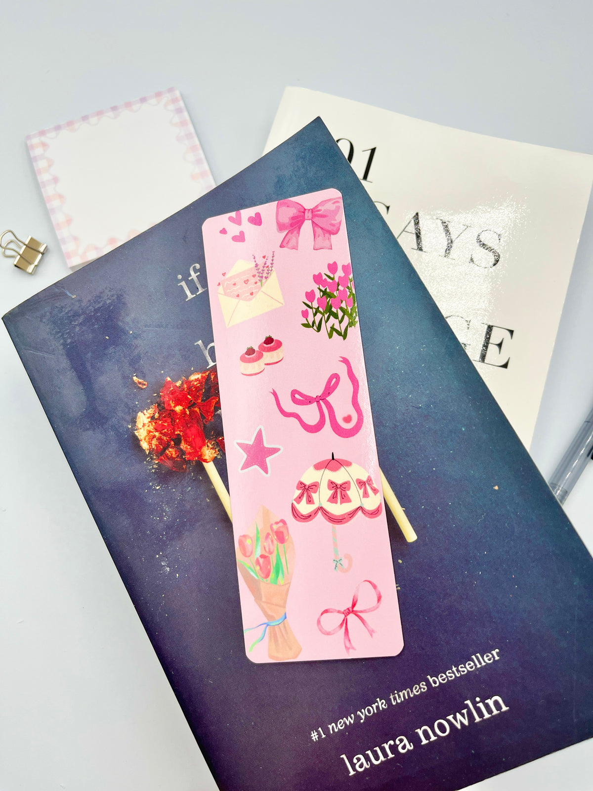 Pink scrapbook bookmark with bow, hearts, stars, and small doodle icons