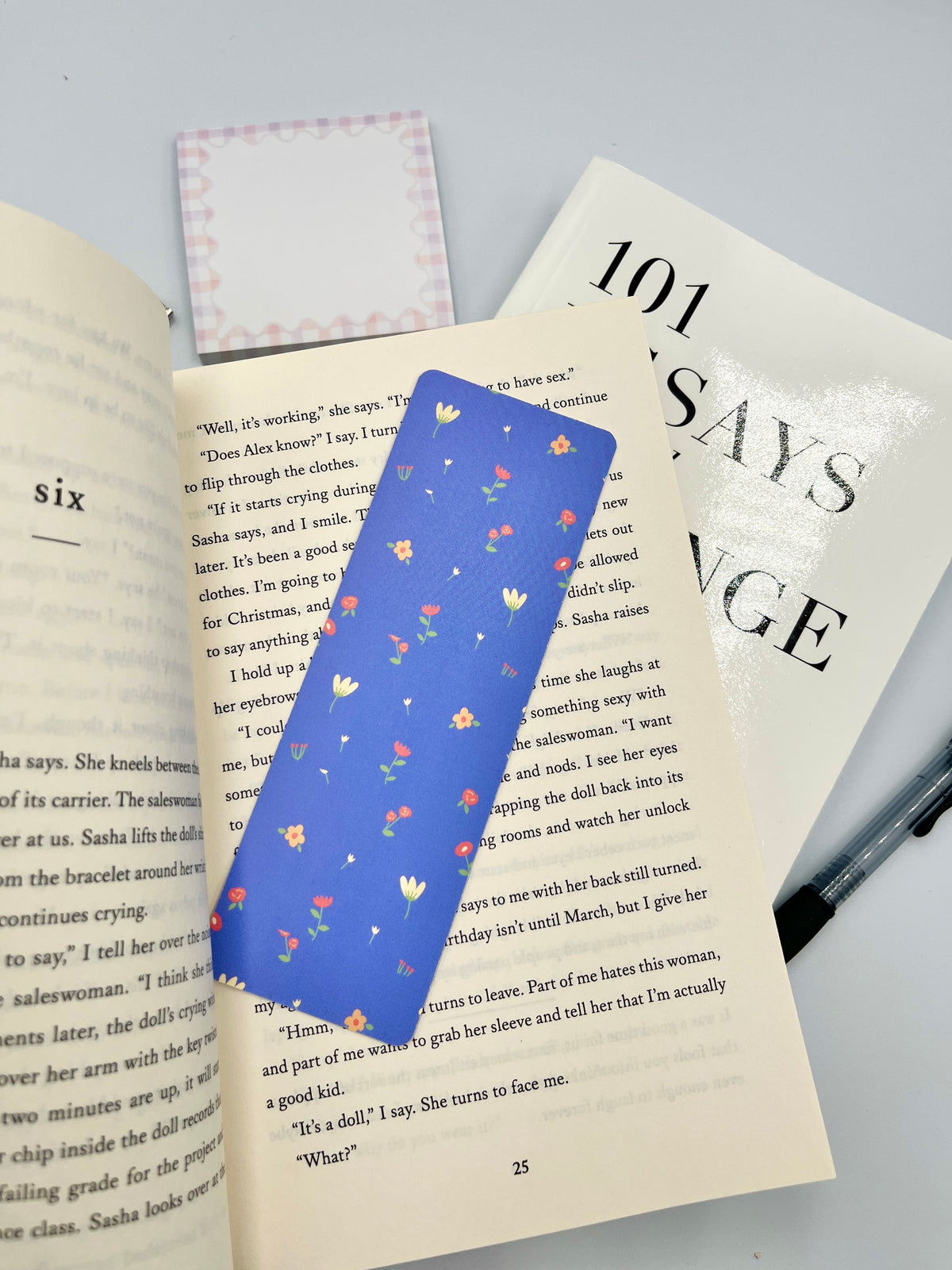 Floral bookmark in blue with colorful tiny flower print and metal loop on top