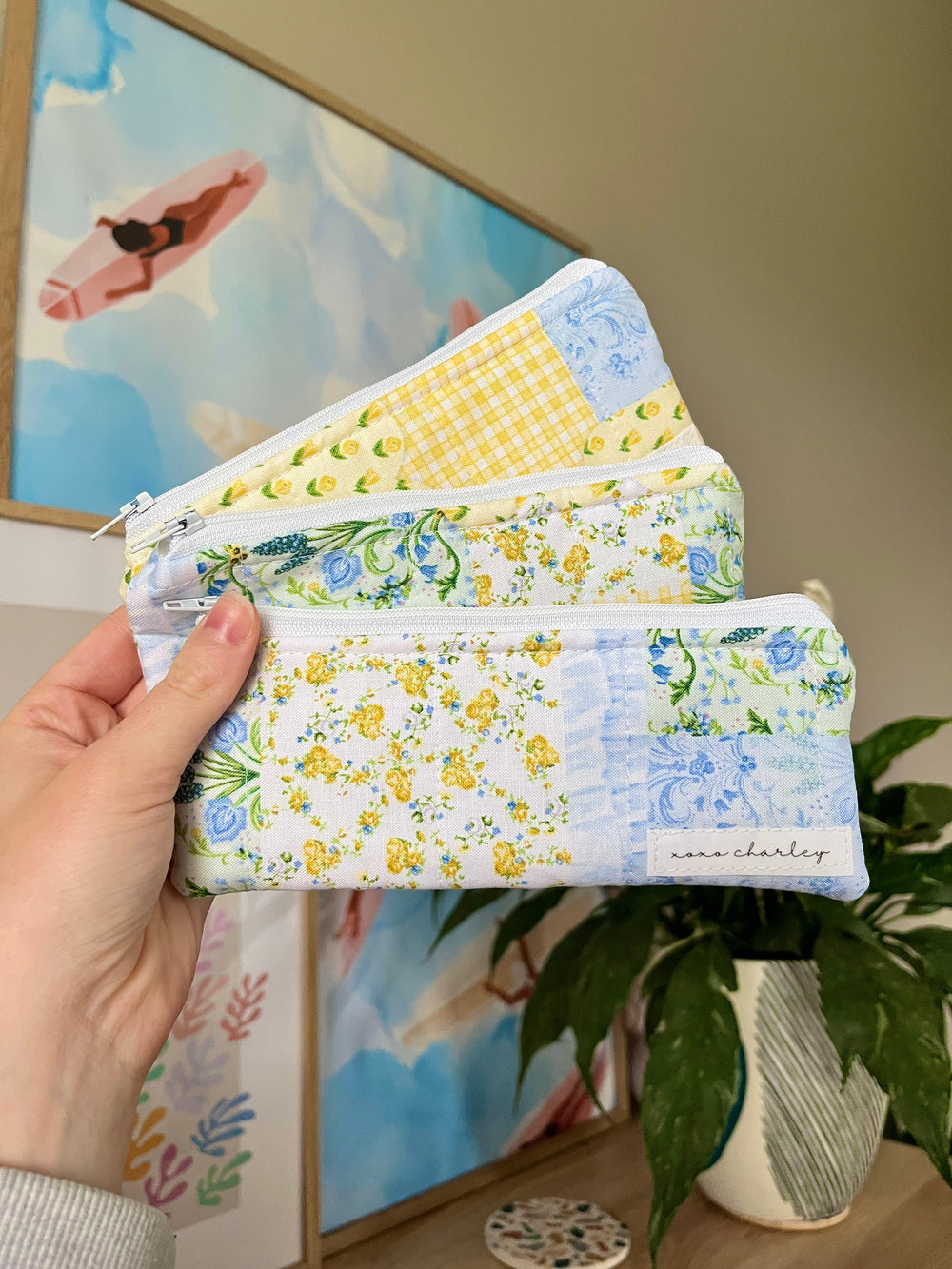 Light blue patchwork pencil and glasses case with zipper, floral and checker details