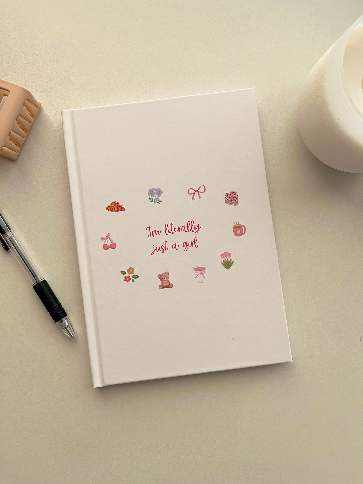 White daily journal with colorful “I'm literally just a girl” graphic cover
