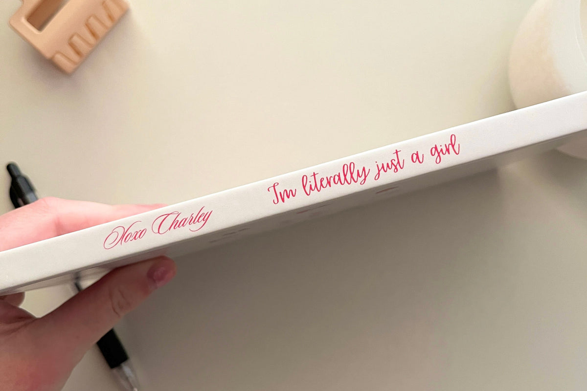 White journal edge band with “I'm literally just a girl” text